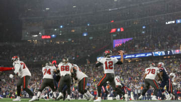 Oct 3, 2021; Foxborough, Massachusetts, USA; Tampa Bay Buccaneers quarterback Tom Brady (12) passes the ball during the first half against the New England Patriots at Gillette Stadium. Mandatory Credit: Paul Rutherford-USA TODAY Sports