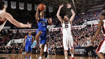Mar 3, 2015; Athens, GA, USA; Kentucky Wildcats guard Aaron Harrison (2) drives to the basket against Georgia Bulldogs forward Kenny Paul Geno (25) during the first half at Stegeman Coliseum. Mandatory Credit: Dale Zanine-USA TODAY Sports