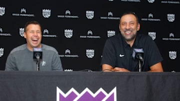 Why are these men smiling? (Photo by Rocky Widner/NBAE via Getty Images)