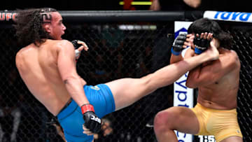 LAS VEGAS, NEVADA - AUGUST 28: (L-R) Bryan Battle kicks Gilbert Urbina in a middleweight fight during the UFC Fight Night event at UFC APEX on August 28, 2021 in Las Vegas, Nevada. (Photo by Chris Unger/Zuffa LLC)
