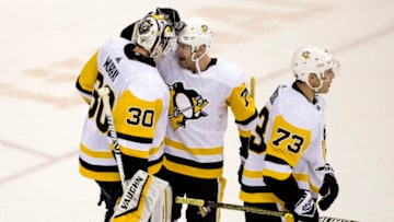 WASHINGTON, DC - DECEMBER 19: Pittsburgh Penguins center Evgeni Malkin (71) and goaltender Matt Murray (30) at the end of a NHL game between the Washington Capitals and the Pittsburgh Penguins on December 19, 2018, at Capital One Arena, in Washington, D.C.(Photo by Tony Quinn/Icon Sportswire via Getty Images)