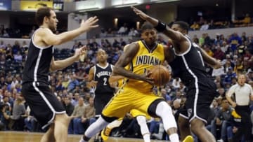 Dec 18, 2015; Indianapolis, IN, USA; Indiana Pacers forward Paul George (13) drives to the basket against Brooklyn Nets guard Joe Johnson (7) at Bankers Life Fieldhouse. Mandatory Credit: Brian Spurlock-USA TODAY Sports