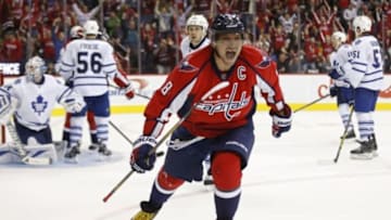 Nov 7, 2015; Washington, DC, USA; Washington Capitals left wing Alex Ovechkin (8) celebrates after scoring a game-tying goal against Toronto Maple Leafs goalie James Reimer (34) in the closing minutes of the third period at Verizon Center. The goal was waved off on a coach
