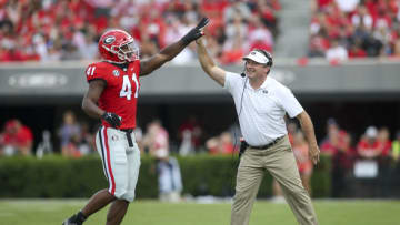 ATHENS, GA - SEPTEMBER 11: Channing Tindall #41 and head coach Kirby Smart of the Georgia Bulldogs show emotion during the first half of their game against the UAB Blazers at Sanford Stadium on September 11, 2021 in Athens, Georgia. (Photo by Brett Davis/Getty Images)