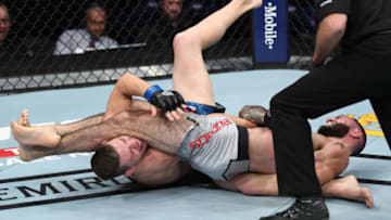 NEW YORK, NY - NOVEMBER 03: (R-L) Shane Burgos submits Kurt Holobaugh in their featherweight bout during the UFC 230 event inside Madison Square Garden on November 3, 2018 in New York, New York. (Photo by Jeff Bottari/Zuffa LLC/Zuffa LLC via Getty Images)