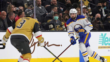 LAS VEGAS, NEVADA - FEBRUARY 01: Alex Tuch #89 of the Buffalo Sabres skates with the puck against Brayden McNabb #3 of the Vegas Golden Knights in the first period of their game at T-Mobile Arena on February 1, 2022 in Las Vegas, Nevada. (Photo by Ethan Miller/Getty Images)