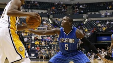 Oct 8, 2015; Indianapolis, IN, USA; Indiana Pacers guard Glenn Robinson III (40) holds the ball as Orlando Magic guard Victor Oladipo (5) defends at Bankers Life Fieldhouse. The Pacers won 97-92. Mandatory Credit: Brian Spurlock-USA TODAY Sports