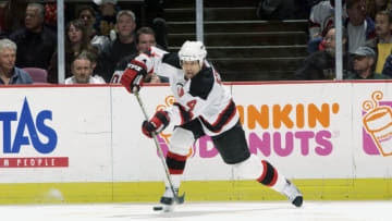 EAST RUTHERFORD, NJ - APRIL 17: Scott Stevens #4 of the New Jersey Devils shoots against the Boston Bruins during game five of the first round of the 2003 Stanley Cup Playoffs on April 17, 2003 at Continental Airlines Arena in East Rutherford, New Jersey. The Devils won the game 3-0 and the series 4-1. (Photo by Ezra Shaw/Getty Images/NHLI)