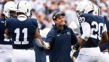 Penn State defensive coordinator Manny Diaz grins as his unit comes to the sideline after creating a turnover late in the the second half of an NCAA football game against Indiana at Beaver Stadium Saturday, Oct. 28, 2023, in State College, Pa.