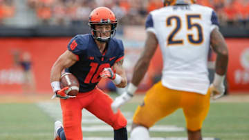 CHAMPAIGN, IL - SEPTEMBER 01: Mike Dudek #18 of the Illinois Fighting Illini runs the ball as Juantez McRae #25 of the Kent State Golden Flashes pursues at Memorial Stadium on September 1, 2018 in Champaign, Illinois. Illinois defeated Kent State 31-24. (Photo by Michael Hickey/Getty Images)