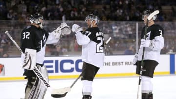 COLORADO SPRINGS, COLORADO - FEBRUARY 15: Jonathan Quick #32, Alec Martinez #27 and Matt Roy #3 of the Los Angeles Kings celebrate their win against the Colorado Avalanche during the 2020 NHL Stadium Series game at Falcon Stadium on February 15, 2020 in Colorado Springs, Colorado. (Photo by Matthew Stockman/Getty Images)