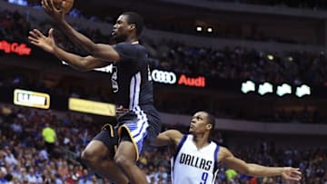 Apr 4, 2015; Dallas, TX, USA; Golden State Warriors forward Harrison Barnes (40) shoots past Dallas Mavericks guard Rajon Rondo (9) during the second half at American Airlines Center. Mandatory Credit: Kevin Jairaj-USA TODAY Sports