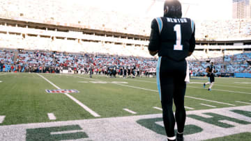 CHARLOTTE, NORTH CAROLINA - DECEMBER 26: Cam Newton #1 of the Carolina Panthers watches from the sideline during the final minute of the team's final home game of the season against the Tampa Bay Buccaneers at Bank of America Stadium on December 26, 2021 in Charlotte, North Carolina. (Photo by Grant Halverson/Getty Images)