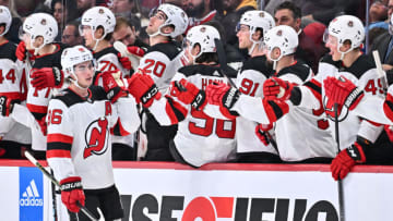 Jack Hughes #86 of the New Jersey Devils celebrates his goal with teammates on the bench during the second period of the game against the Montreal Canadiens at Centre Bell on November 15, 2022 in Montreal, Quebec, Canada. (Photo by Minas Panagiotakis/Getty Images)