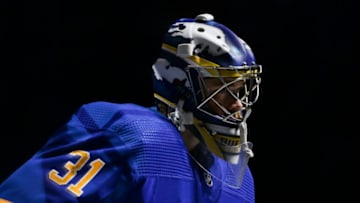 BUFFALO, NEW YORK - NOVEMBER 08: Eric Comrie #31 of the Buffalo Sabres takes the ice before the game against the Arizona Coyotes at KeyBank Center on November 08, 2022 in Buffalo, New York. (Photo by Joshua Bessex/Getty Images)