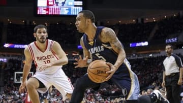 Jan 24, 2014; Houston, TX, USA; Memphis Grizzlies shooting guard Courtney Lee (5) controls the ball during the fourth quarter as Houston Rockets small forward Omri Casspi (18) defends at Toyota Center. The Grizzlies defeated the Rockets 88-87. Mandatory Credit: Troy Taormina-USA TODAY Sports