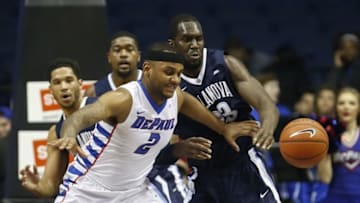 Feb 9, 2016; Rosemont, IL, USA; DePaul Blue Demons center Tommy Hamilton IV (2) battles for the ball with Villanova Wildcats forward Daniel Ochefu (23) during the first half at Allstate Arena. Mandatory Credit: Kamil Krzaczynski-USA TODAY Sports