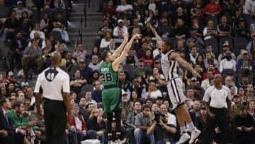 Dec 5, 2015; San Antonio, TX, USA; Boston Celtics shooting guard R.J. Hunter (28) shoots the ball over San Antonio Spurs small forward Kawhi Leonard (2,R) during the second half at AT&T Center. Mandatory Credit: Soobum Im-USA TODAY Sports