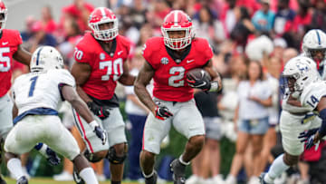 Sep 10, 2022; Athens, Georgia, USA; Georgia Bulldogs running back Kendall Milton (2) runs the ball against the Samford Bulldogs during the second half at Sanford Stadium. Mandatory Credit: Dale Zanine-USA TODAY Sports