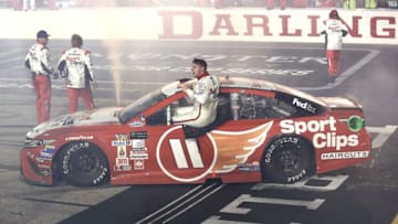 DARLINGTON, SC - SEPTEMBER 03: Denny Hamlin, driver of the #11 Sport Clips Toyota, celebrates winning the Monster Energy NASCAR Cup Series Bojangles' Southern 500 at Darlington Raceway on September 3, 2017 in Darlington, South Carolina. (Photo by Jerry Markland/Getty Images)