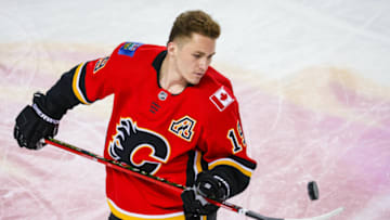 Apr 23, 2021; Calgary, Alberta, CAN; Calgary Flames left wing Matthew Tkachuk (19) controls the puck during the warmup period against the Montreal Canadiens at Scotiabank Saddledome. Mandatory Credit: Sergei Belski-USA TODAY Sports