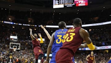Dec 25, 2016; Cleveland, OH, USA; Cleveland Cavaliers guard Kyrie Irving (2) makes the winning shot against Golden State Warriors guard Klay Thompson (11) at Quicken Loans Arena. Cleveland defeats Golden State 109-108. Mandatory Credit: Brian Spurlock-USA TODAY Sports