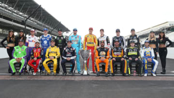 INDIANAPOLIS, INDIANA - SEPTEMBER 08: Ryan Newman, driver of the #6 Acorns Ford, Kyle Larson, driver of the #42 McDonald's Chevrolet, Erik Jones, driver of the #20 STANLEY Wish For Our Heros Toyota, William Byron, driver of the #24 Liberty University Chevrolet, Martin Truex Jr, driver of the #19 AOI Toyota, Clint Bowyer, driver of the #14 Rush/Cummins Ford, Ryan Blaney, driver of the #12 Wabash National Ford, Chase Elliott, driver of the #9 NAPA AUTO PARTS Chevrolet, Denny Hamlin, driver of the #11 FedEx Express Toyota, Alex Bowman, driver of the #88 Nationwide Chevrolet, Kurt Busch, driver of the #1 Monster Energy Chevrolet, Kyle Busch, driver of the #18 M&M's Toyota, Joey Logano, driver of the #22 Shell Pennzoil Ford, Brad Keselowski, driver of the #2 Discount Tire Ford, Kevin Harvick, driver of the #4 Mobil 1 Ford, Aric Almirola, driver of the #10 Smithfield/Meijer Ford, pose for a photo with the Monster Energy NASCAR Cup Series trophy to start the playoffs following the Monster Energy NASCAR Cup Series Big Machine Vodka 400 at the Brickyard at Indianapolis Motor Speedway on September 08, 2019 in Indianapolis, Indiana. (Photo by Brian Lawdermilk/Getty Images)