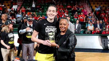 FAIRFAX, VA - SEPTEMBER 12: Breanna Stewart #30 of the Seattle Storm is presented the 2018 Most Valuble Player award from the WNBA President Lisa Borders after winning the 2018 WNBA Finals against the Washington Mystics during Game Three of the 2018 WNBA Finals on September 12, 2018 at Eaglebank Arena at George Mason University in Fairfax, VA. NOTE TO USER: User expressly acknowledges and agrees that, by downloading and or using this photograph, User is consenting to the terms and conditions of the Getty Images License Agreement. Mandatory Copyright Notice: Copyright 2018 NBAE (Photo by Ned Dishman/NBAE via Getty Images)