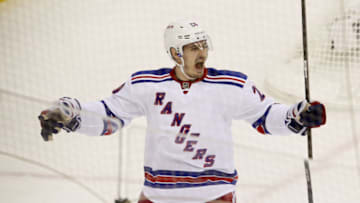 NEWARK, NJ - MAY 19: Chris Kreider #20 of the New York Rangers celebrates his third period goal in Game Three of the Eastern Conference Final against the New Jersey Devils during the 2012 NHL Stanley Cup Playoffs at the Prudential Center on May 19, 2012 in Newark, New Jersey. (Photo by Jim McIsaac/Getty Images)