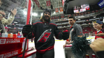 Jan 29, 2023; Raleigh, North Carolina, USA; Carolina Hurricanes defenseman Jalen Chatfield (5) comes off the ice after warmups past the fans against the Boston Bruins at PNC Arena. Mandatory Credit: James Guillory-USA TODAY Sports