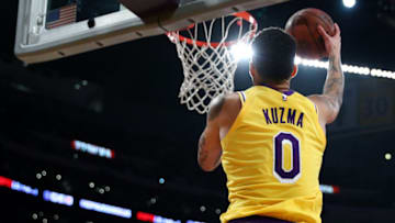 LOS ANGELES, CALIFORNIA - MARCH 26: Kyle Kuzma #0 of the Los Angeles Lakers drives to the basket against the Washington Wizards during the second half at Staples Center on March 26, 2019 in Los Angeles, California. (Photo by Yong Teck Lim/Getty Images)