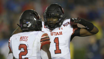 PASADENA, CA - OCTOBER 26: Zack Moss #2 and Tyler Huntley #1 of the Utah Utes celebrate after a touchdown in the second half at the Rose Bowl on October 26, 2018 in Pasadena, California. Utah won 41-10. (Photo by John McCoy/Getty Images)