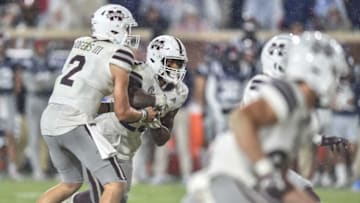 Auburn footballMississippi State QB Will Rogers (2) hands off the ball to DL Dillon Johnson (23) at the 2022 Egg Bowl at Ole Miss' Vaught-Hemingway Stadium in Oxford, Miss., Thursday, November 24, 2022. Mississippi State beat Ole Miss with a final score of 24-22.Ejs 3957