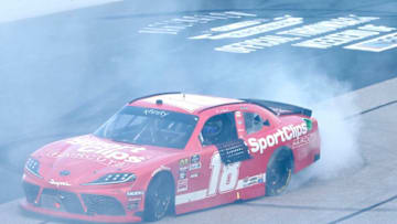 DARLINGTON, SOUTH CAROLINA - AUGUST 31: Denny Hamlin, driver of the #18 Sport Clips Toyota, celebrates after winning the NASCAR Xfinity Series Sport Clips Haircuts VFW 200 at Darlington Raceway on August 31, 2019 in Darlington, South Carolina. (Photo by Brian Lawdermilk/Getty Images)