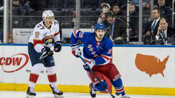 NEW YORK, NY - NOVEMBER 17: New York Rangers Left Wing Chris Kreider (20) works the puck through the neutral zone during the first period of a regular season NHL game between the Florida Panthers and the New York Rangers on November 17, 2018, at Madison Square Garden in New York, NY. (Photo by David Hahn/Icon Sportswire via Getty Images)