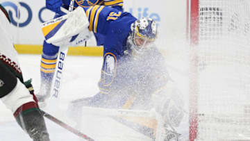 BUFFALO, NEW YORK - NOVEMBER 08: Eric Comrie #31 of the Buffalo Sabres blocks a shot during the third period of an NHL hockey game against the Arizona Coyotes at KeyBank Center on November 08, 2022 in Buffalo, New York. (Photo by Joshua Bessex/Getty Images)