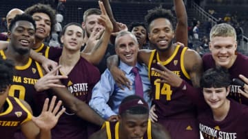 LAS VEGAS, NEVADA - NOVEMBER 21: Head coach Bobby Hurley (C) of the Arizona State Sun Devils is surrounded by his team after defeating the Utah State Aggies, 87-82 in championship game in the MGM Resorts Main Event basketball tournament at T-Mobile Arena on November 21, 2018 in Las Vegas, Nevada. (Photo by David Becker/Getty Images)