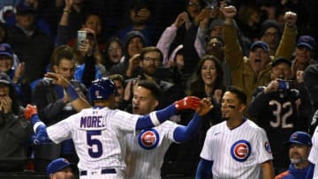May 17, 2022; Chicago, Illinois, USA; Chicago Cubs Christopher Morel (5) greets catcher Willson Contreras (40) after hitting a solo home run against the Pittsburgh Pirates during the eighth inning at Wrigley Field. It was his first home run at his first at bat in the major leagues. Mandatory Credit: Matt Marton-USA TODAY Sports