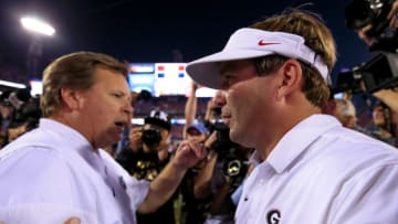 JACKSONVILLE, FL - OCTOBER 29: Head coaches Kirby Smart of the Georgia Bulldogs and Jim McElwain of the Florida Gators shake hands after the game at EverBank Field on October 29, 2016 in Jacksonville, Florida. (Photo by Rob Foldy/Getty Images)