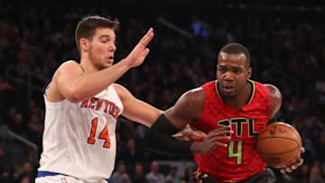 Nov 20, 2016; New York, NY, USA; Atlanta Hawks forward Paul Millsap (4) drives against New York Knicks center Willy Hernangomez (14) during the fourth quarter at Madison Square Garden. New York Knicks won 104-94. Mandatory Credit: Anthony Gruppuso-USA TODAY Sports