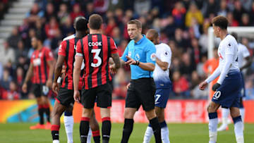 BOURNEMOUTH, ENGLAND - MAY 04: Referee Craig Pawson speaks with Steve Cook of AFC Bournemouth during the Premier League match between AFC Bournemouth and Tottenham Hotspur at Vitality Stadium on May 04, 2019 in Bournemouth, United Kingdom. (Photo by Justin Setterfield/Getty Images)