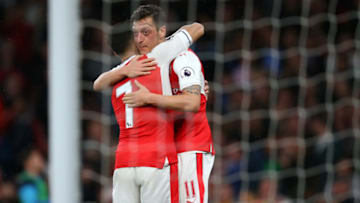 LONDON, ENGLAND - MAY 16: Alexis Sanchez of Arsenal hugs Mesut Ozil of Arsenal during the Premier League match between Arsenal and Sunderland at Emirates Stadium on May 16, 2017 in London, England. (Photo by Catherine Ivill - AMA/Getty Images)