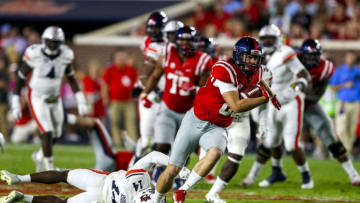 OXFORD, MS - OCTOBER 29: Tight end Taz Zettergren #89 of the Mississippi Rebels catches a pass as defensive back Stephen Roberts #14 of the Auburn Tigers tries to tackle during the first half of an NCAA college football game on October 29, 2016 in Oxford, Mississippi. (Photo by Butch Dill/Getty Images)