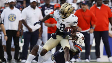 Auburn footballSep 4, 2021; Auburn, Alabama, USA; Akron Zips receiver Anthony Williams, Jr. (2) is tackled by Auburn Tigers linebacker Owen Pappoe (0)during the first quarter at Jordan-Hare Stadium. Mandatory Credit: John Reed-USA TODAY Sports