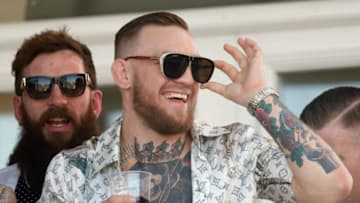 LIVERPOOL, UNITED KINGDOM - APRIL 08: (EMBARGOED FOR PUBLICATION IN UK NEWSPAPERS UNTIL 48 HOURS AFTER CREATE DATE AND TIME) Conor McGregor, current UFC Lightweight Champion, watches the racing as he attends day 3 'Grand National Day' of the Randox Health Grand National Festival at Aintree Racecourse on April 8, 2017 in Liverpool, England. (Photo by Max Mumby/Indigo/Getty Images)