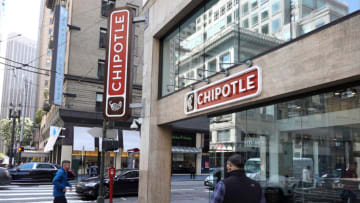 SAN FRANCISCO, CALIFORNIA - APRIL 26: Pedestrians walk by a Chipotle restaurant on April 26, 2022 in San Francisco, California. Chipotle Mexican Grill will report its first quarter earnings today after the closing bell. (Photo by Justin Sullivan/Getty Images)