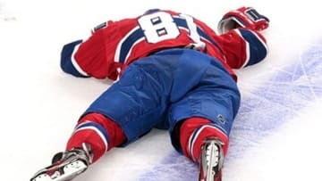 May 2, 2013; Montreal, Quebec, CAN; Montreal Canadiens center Lars Eller (81) lies on ice after being hurt during the second period against Ottawa Senators in game one of the first round of the 2013 Stanley Cup playoffs at the Bell Centre. Mandatory Credit: Jean-Yves Ahern-USA TODAY Sports