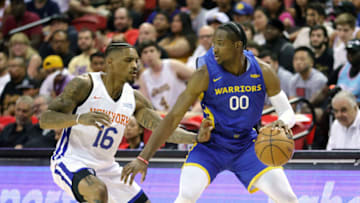 LAS VEGAS, NEVADA - JULY 08: Jonathan Kuminga #0 of the Golden State Warriors brings the ball up the court against the DaQuan Jeffries #16 of the New York Knicks during the 2022 NBA Summer League at the Thomas & Mack Center on July 08, 2022 in Las Vegas, Nevada. NOTE TO USER: User expressly acknowledges and agrees that, by downloading and or using this photograph, User is consenting to the terms and conditions of the Getty Images License Agreement. (Photo by Ethan Miller/Getty Images)