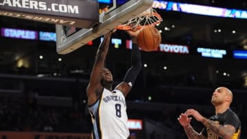 February 26, 2016; Los Angeles, CA, USA; Memphis Grizzlies forward James Ennis (8) dunks to score a basket in front of Los Angeles Lakers center Robert Sacre (50) during the second half at Staples Center. Mandatory Credit: Gary A. Vasquez-USA TODAY Sports