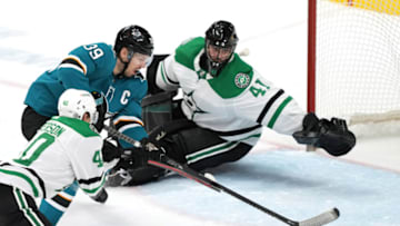 Apr 2, 2022; San Jose, California, USA; San Jose Sharks center Logan Couture (39) skates against Dallas Stars center Jacob Peterson (40) and goaltender Scott Wedgewood (41) during the third period at SAP Center at San Jose. Mandatory Credit: Darren Yamashita-USA TODAY Sports
